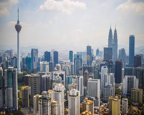 Aerial view of Kuala Lumpur city center near Ilham Tower during daytime